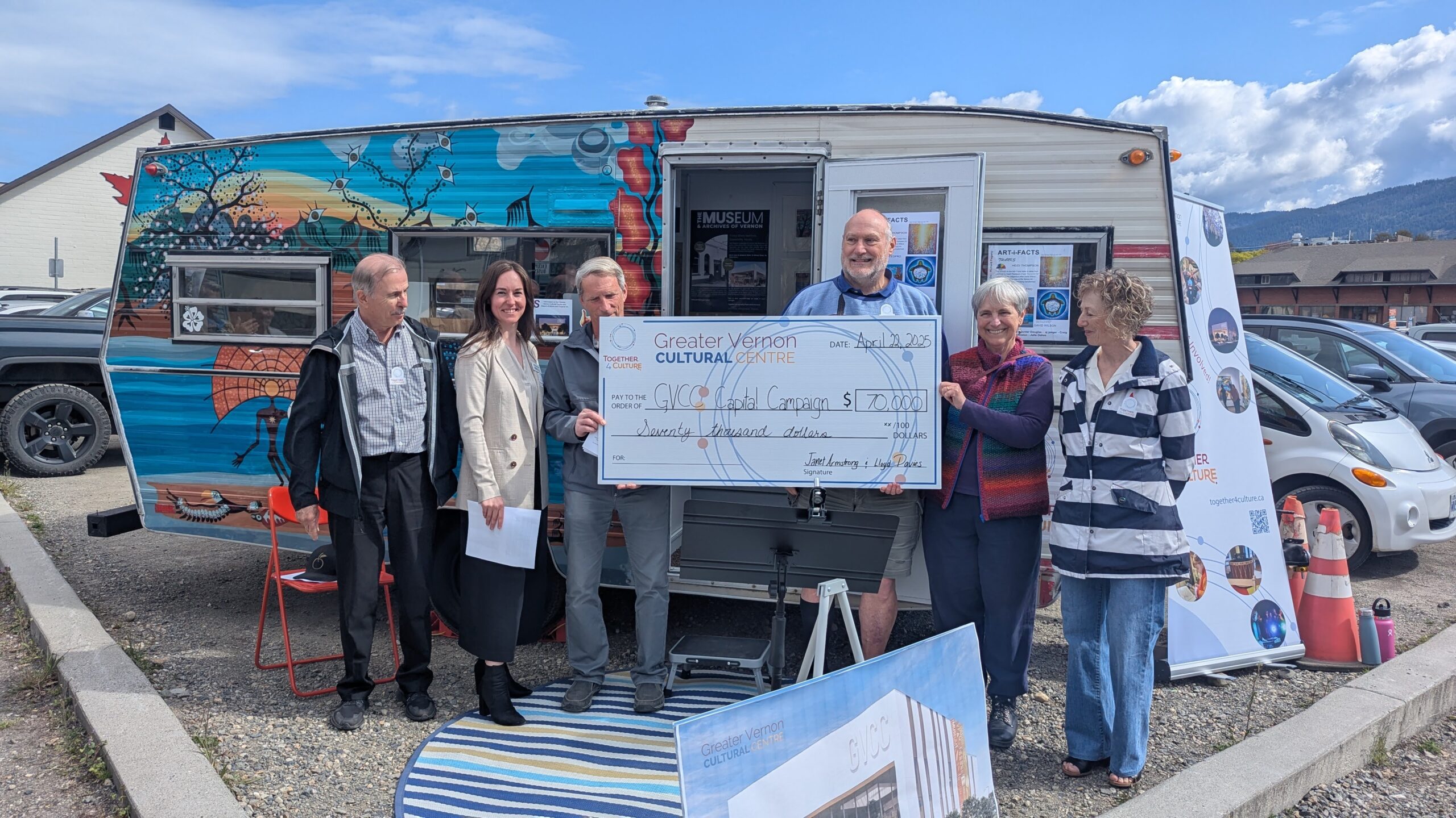 photo of cheque being presented by donors to the fund-raising campaign